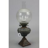 A cast-iron oil table lamp with etched-glass globular shade, 22” high; together with various