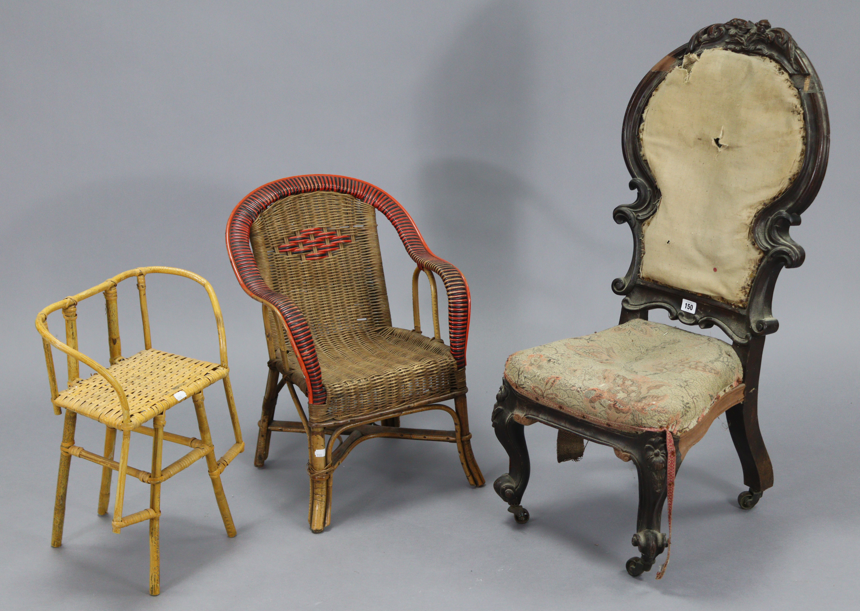 A Victorian carved mahogany frame child’s chair with shield-shaped back, padded seat, & on short