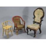 A Victorian carved mahogany frame child’s chair with shield-shaped back, padded seat, & on short