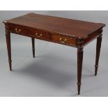A 19th century-style mahogany side table fitted three frieze drawers, & on four turned & fluted