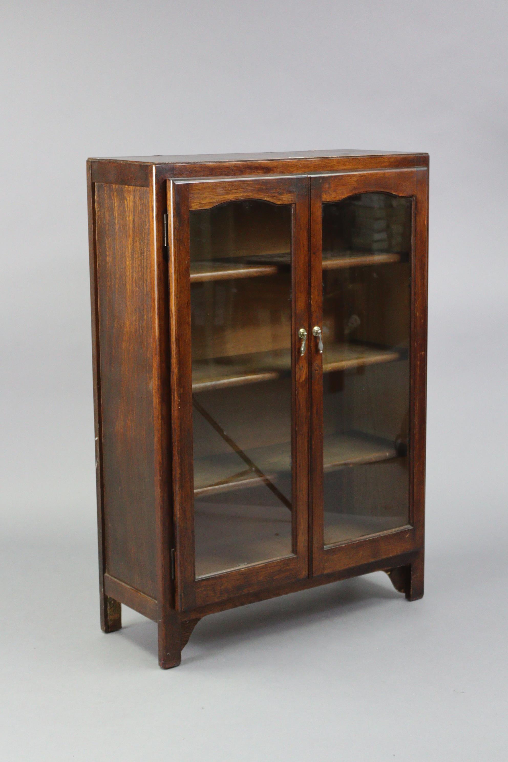 An oak bookcase fitted three shelves enclosed by a pair of glazed doors, 29½” wide x 42½” high. - Image 3 of 4