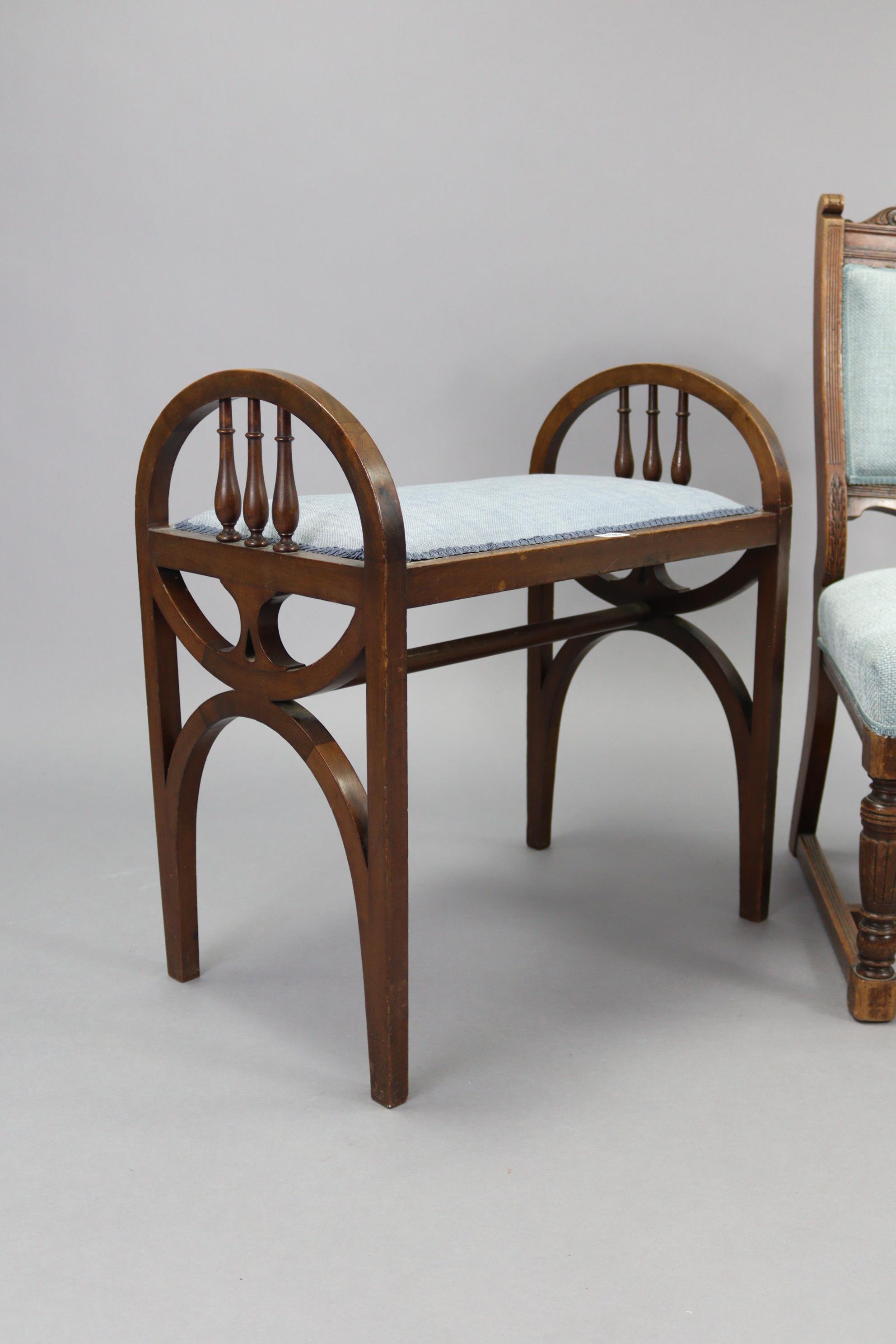 An Edwardian mahogany piano stool with padded seat, spindle-rail to each arm support, & on shaped - Image 2 of 3