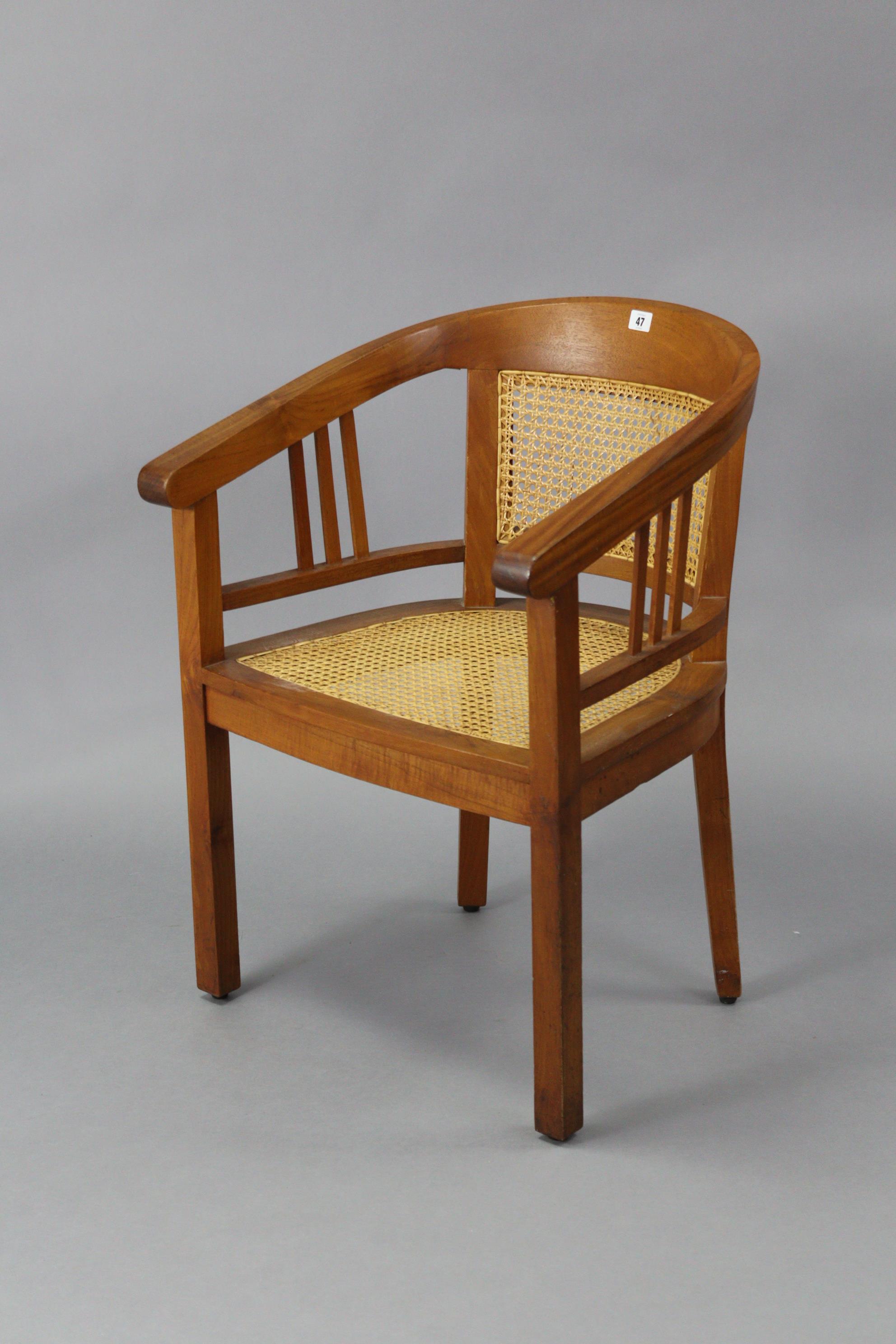 A teak tub-shaped chair inset woven-cane panel to the seat & back, & on square tapered legs. - Image 2 of 4