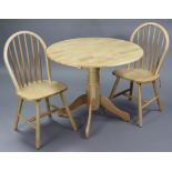 A maple-finish circular drop-leaf kitchen table on vase-turned centre column & four splay legs,