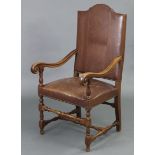 A beech frame armchair in the 17th century Spanish style, with tall padded back & sprung seat