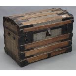 A fibre-covered ribbed domed-top travelling trunk with hinged lift-lid, 32” wide x 22” high x 19”