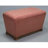 An early 20th century mahogany box-ottoman upholstered crimson-gold geometric material, with