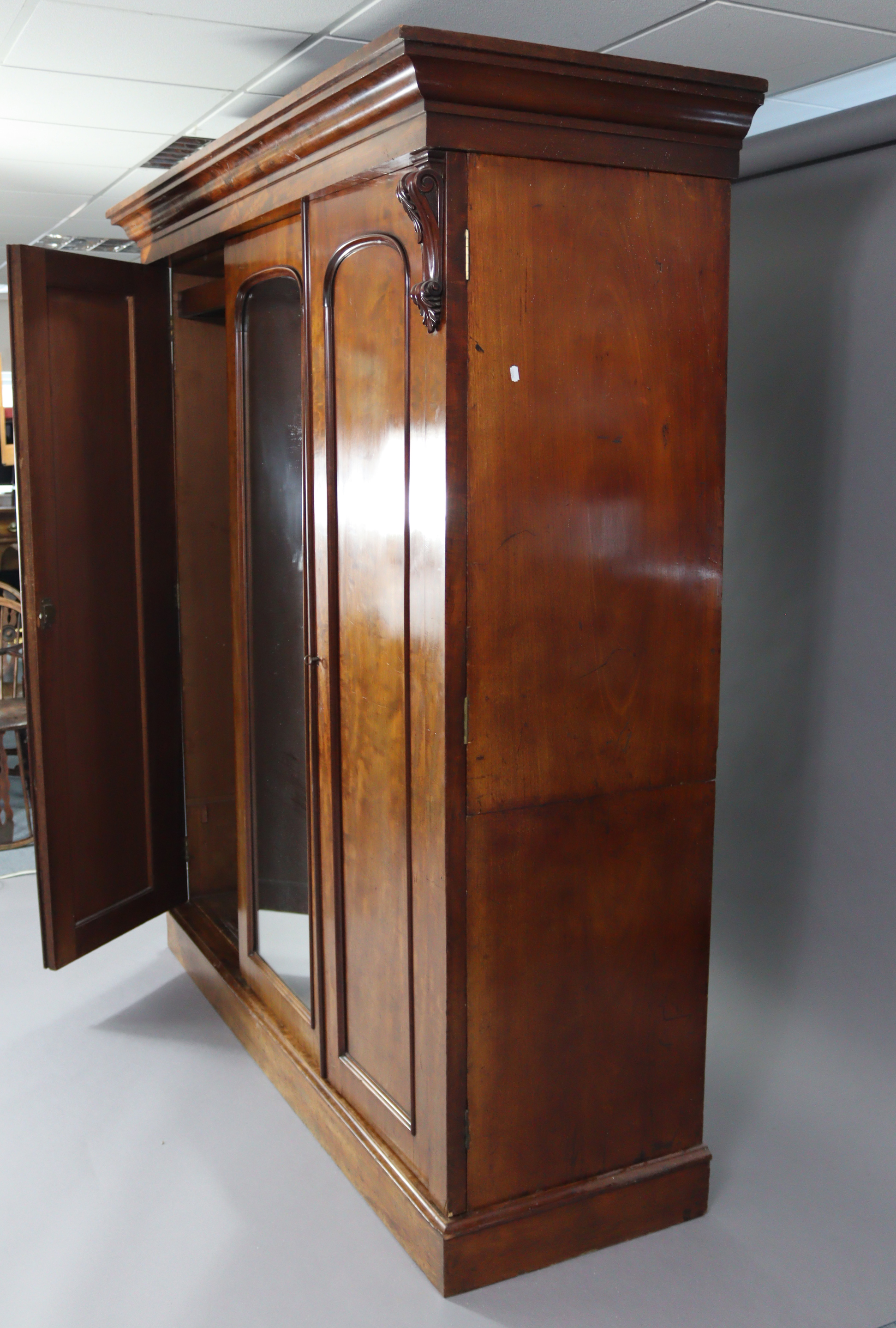 A Victorian hanging mahogany wardrobe with moulded cornice, enclosed centre mirror door, a panel - Image 6 of 9