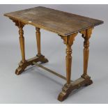 An oak kitchen table with rectangular top, & on a pair of turned supports to either end joined by