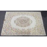 An Indian carpet of white ground & with all-over repeating multi-coloured floral design; 12ft x 9ft.