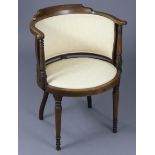 An Edwardian inlaid mahogany tub-shaped elbow chair with padded seat & back, on turned & tapered