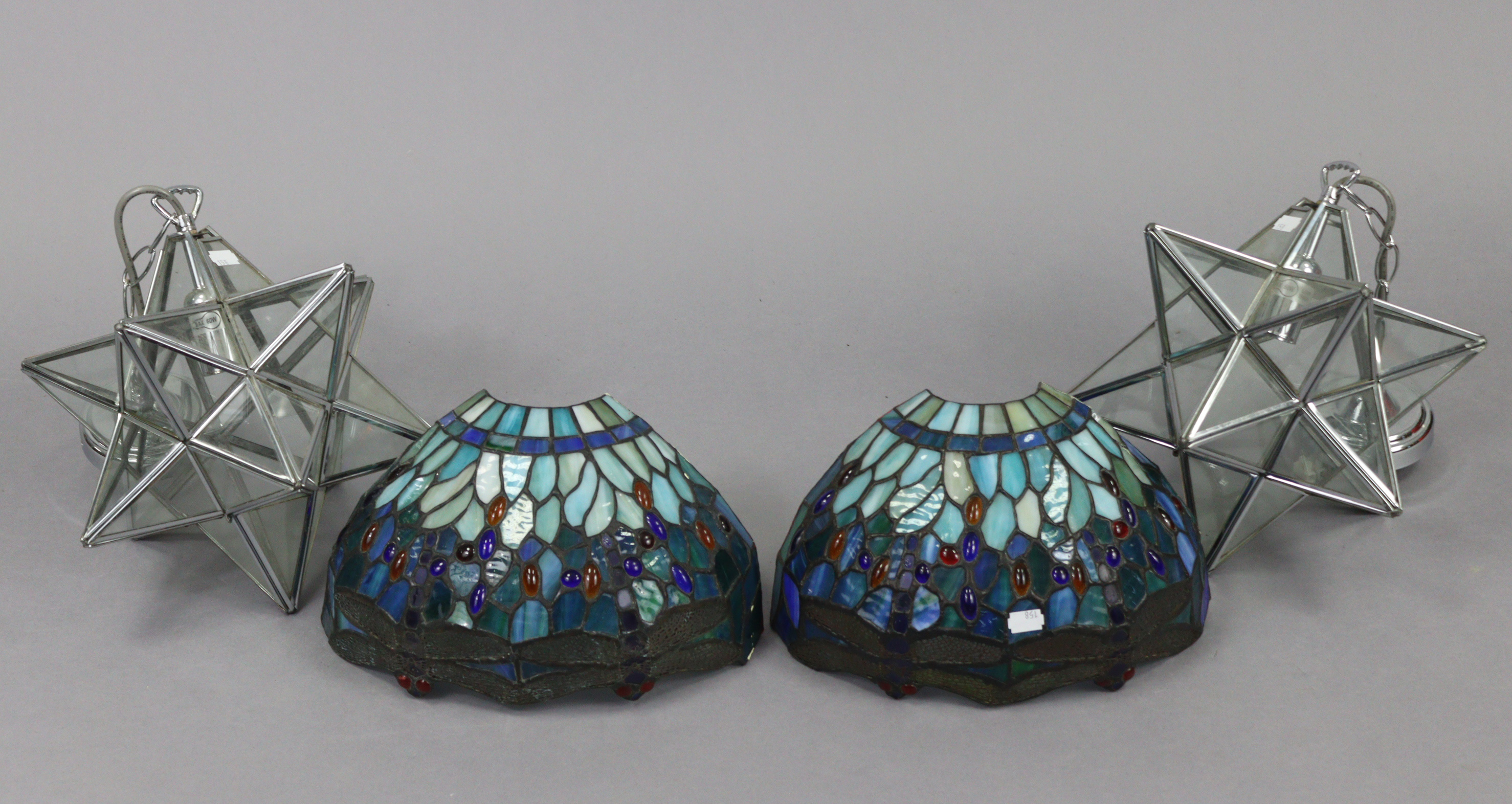 A pair of leaded & mottled glass wall lights of demi-lune form & with dragonfly decoration, 12½”