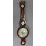 A late 19th/early 20th century aneroid wall barometer with 7¾” diameter silvered dial, & in inlaid-