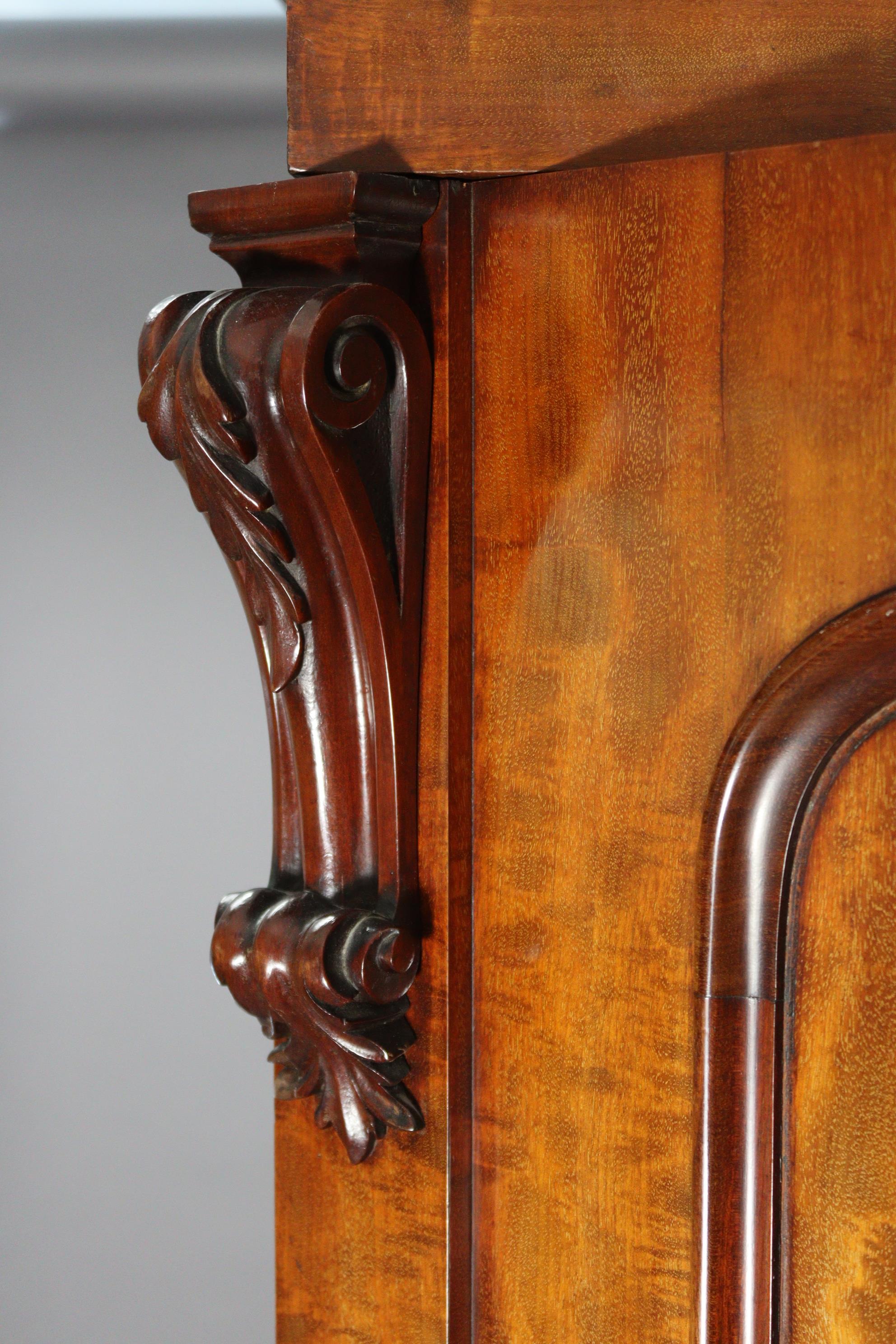 A Victorian hanging mahogany wardrobe with moulded cornice, enclosed centre mirror door, a panel - Image 4 of 9