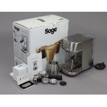 A Sage “Bambino Plus” coffee machine; & a box of twenty Nespresso coffee refills.
