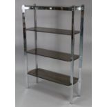 A contemporary silvered-metal standing open bookcase with square supports, & fitted with four