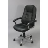 A black leatherette & silvered-metal swivel desk chair.