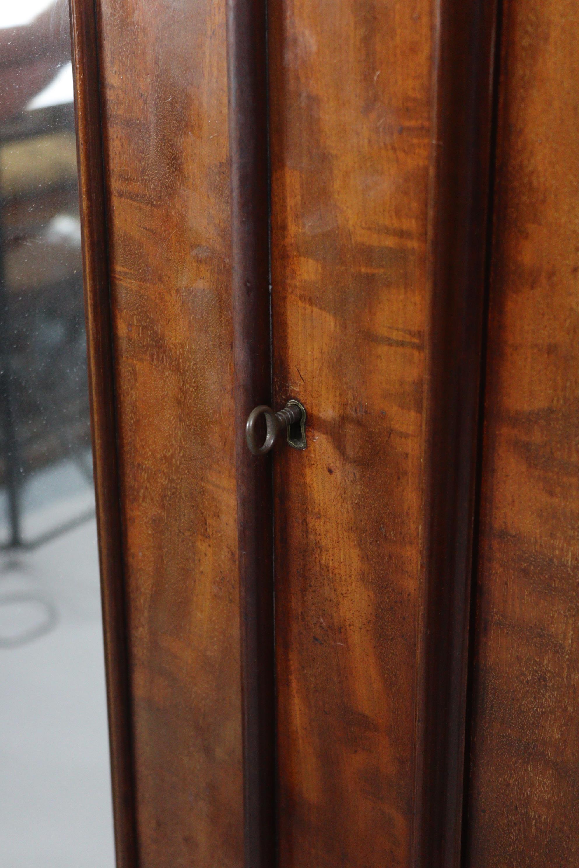 A Victorian hanging mahogany wardrobe with moulded cornice, enclosed centre mirror door, a panel - Image 7 of 9