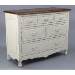 A modern continental-style cream painted wooden chest fitted with an arrangement of six drawers with