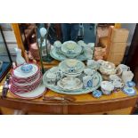 A flex-arm table lamp on cast-metal base; together with twelve various commemorative mugs; & two