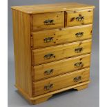 A pine upright chest fitted two short & four long drawers with brass swan-neck handles, & on bracket