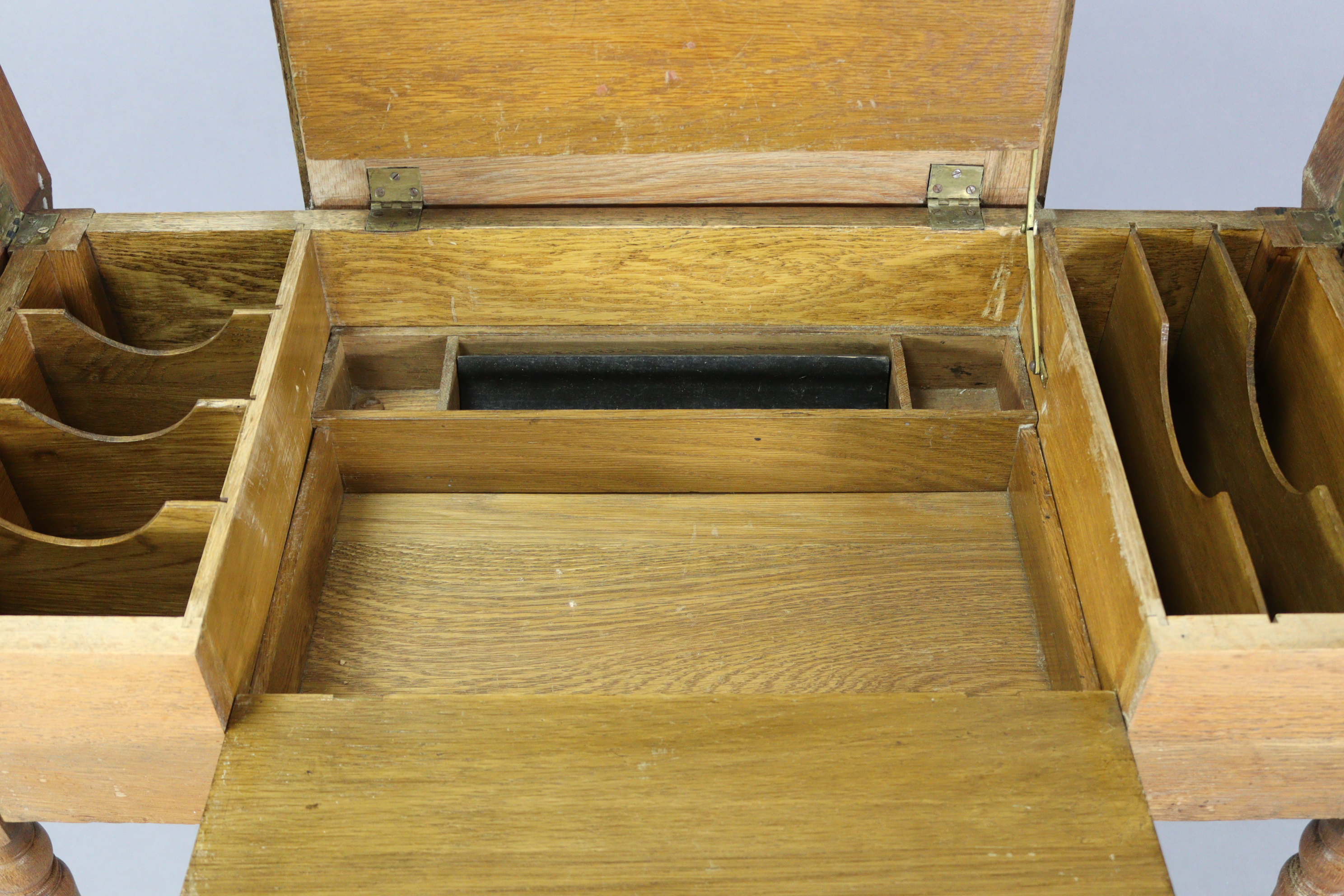 An Edwardian oak writing table with fitted interior enclosed by three hinged panels, & on turned - Image 3 of 7