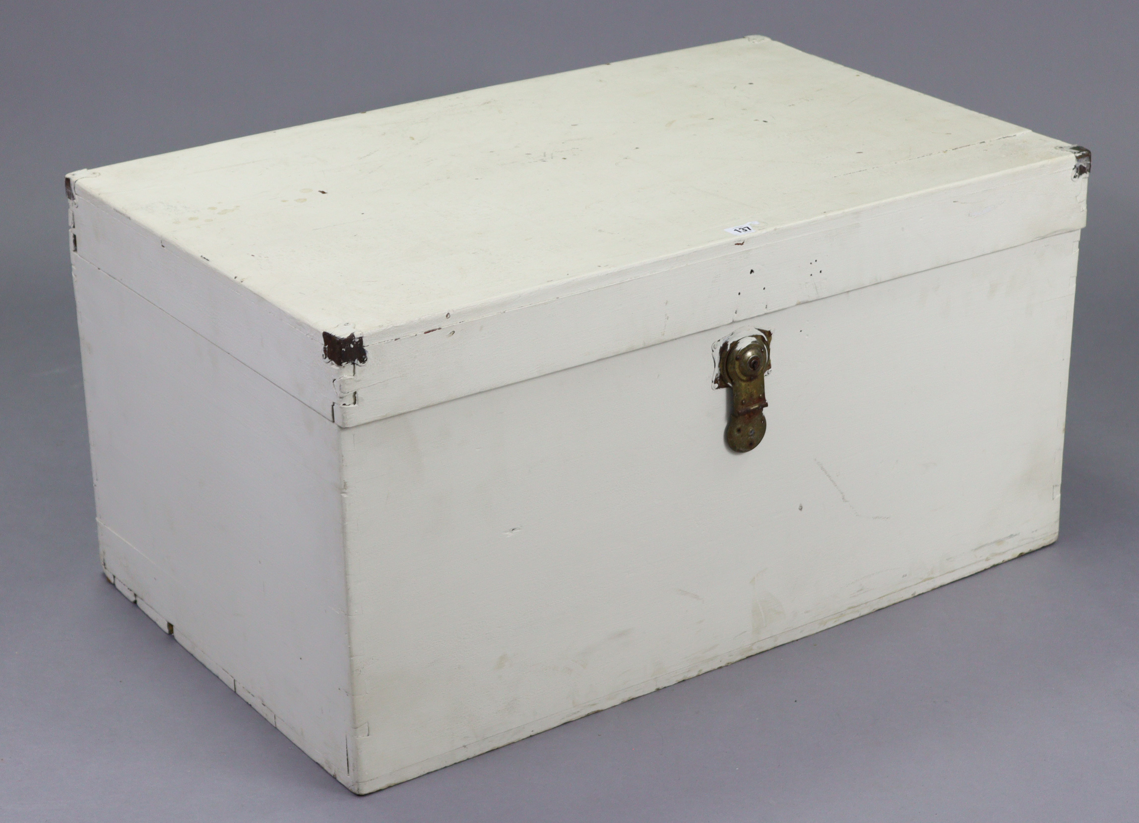 An early/mid-20th century white painted deal storage trunk with hinged lift-lid, 35½” wide x 18”