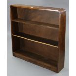 An oak standing open bookcase with two adjustable shelves, square tapered end supports, & on