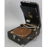 An HMV portable gramophone player in black fibre-covered case, & with carrying case.