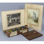 Two vintage sepia photographs, each depicting cyclists, mounted, unframed; a collection of glass