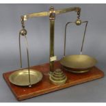A late 19th/early 20th century large brass beam scale by W.A. Webb Ltd. of London mounted on