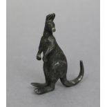 A Stewart Dawson silver(?) model of a standing kangaroo (stamped to tail), 3¾” high.
