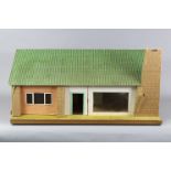 A paper-covered wooden bungalow doll’s house, with opening front & back, 37” wide x 18½” high x