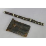 A rosewood flute (lacking mouthpiece) with chrome-plated keys, 19½” long, with case.