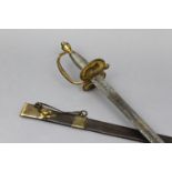 A late 18th century cavalry officer’s dress sword with etched scroll design to the 31” long single-