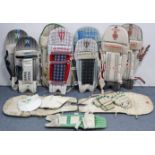 Ten various cricketer’s pads; & a pair of cricketer’s gloves.