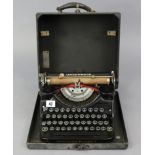 An Underwood portable typewriter with black fibre-covered case.