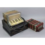 A Scarlatti piano accordion with black fibre-covered travelling case (slight faults); & another