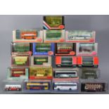 Twenty various scale model buses, each with window box.