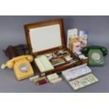 A mahogany artist’s portable paint box containing numerous paints & brushes, 14¾” wide; together