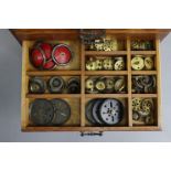 A collection of Meccano including struts, wheels, cogs, etc., contained in a small oak chest