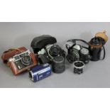 A Praktica “MTL3” 35mm camera; together with three other cameras; & various camera accessories.