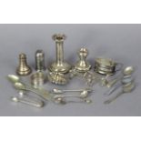 Two silver candlesticks, 4½” & 2½” high; together with four silver condiments; a silver napkin ring;