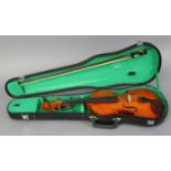 A “Stentor Student” violin & bow by Stentor Music of England, 24” long, with case.