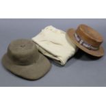 A green pith helmet, size 7?; a straw boater hat by Battersby of London, size 7?; a pair of cream