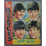 A 1960’S SCRAP BOOK “THE BEATLES” CONTAINING A TOTAL OF ONE HUNDRED AND FIVE A + BC “Beatles”