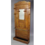 An ash hallstand, inset bevelled rectangular mirror to the top, 33¾” wide x 77½” high.