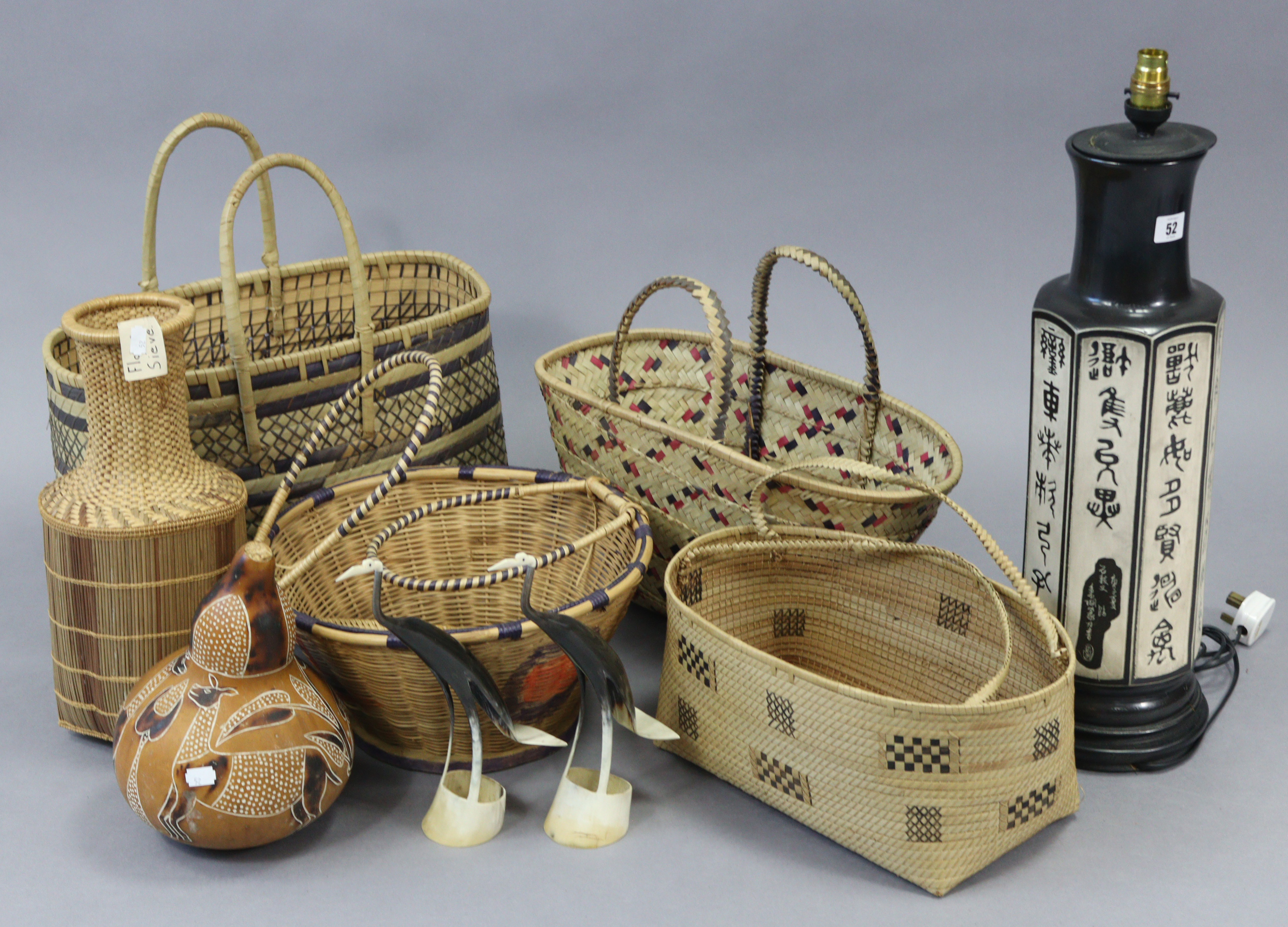 A Japanese-style metal table lamp; an Aboriginal gourd vessel, various similar wicker baskets & bow