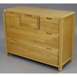 AN ERCOL ‘BOSCO 5’ LIGHT ELM CHEST (model 1362), fitted three short & two long graduated drawers,