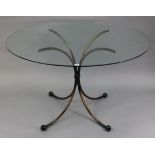 A contemporary wrought-iron breakfast table on four shaped legs & with tempered-glass top, 48” diam.